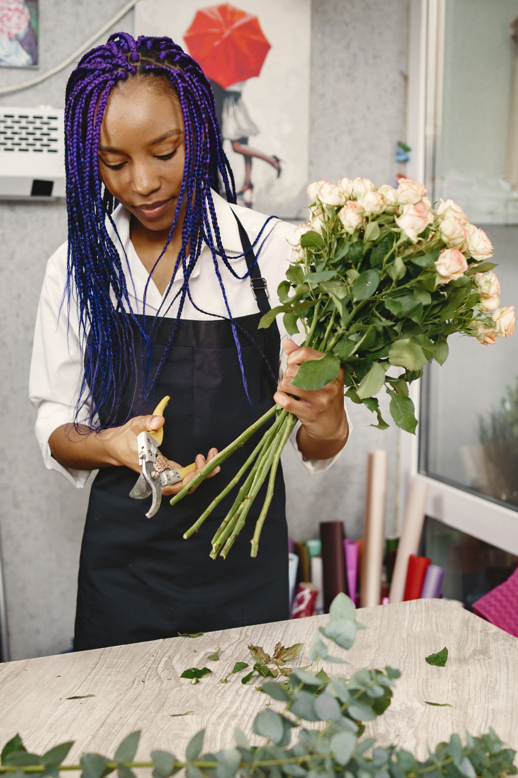 Portrait of joyful African American young woman in flower store Florist Choice Bouquet Roodepoort